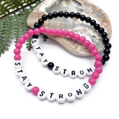 Wear your inspiration on your wrist! A simple STAY STRONG acrylic bead bracelet will motivate and help you get through every day. This custom made bracelet has 6mm acrylic beads and flat white acrylic letter beads, which are 7mm diameter. It is thread on strong elastic and will stretch a little bit so you can roll it onto your wrist gently. Allergy friendly, lightweight and super comfortable to wear! Comes in more than 20 gorgeous colour options and 12 sizes up to 4XL, so you will always find on Inspirational White Bracelets With Letter Print, Letter Bead Bracelet, Letter Bead Bracelets, Acrylic Letters, Flat White, Letter Beads, Allergy Friendly, White Flats, White Acrylic