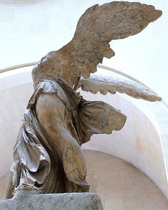 an angel statue in the middle of a building