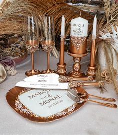 a table topped with lots of gold and white items