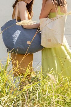 An upscale market tote that functions as well as it looks, the Hana Canvas Boat Bag is a unique and beautiful carryall. Made of heavy-weight canvas in hand-dyed hues that capture the changing light of warm afternoons. Triple wash techniques bring out a relaxed sun-kissed softness to the heavy gauge canvas, while hand-frayed deconstructed edges remind us to let our hair down. The Hana Canvas Tote features sturdy vegetable-tanned leather shoulder straps and trim on the base seams, a nickel snap cl Boat Bag, Hair Down, Market Tote, Sun Kissed, Vegetable Tanned Leather, Down Hairstyles, Casual Bags, Bag Straps, Perfect Summer