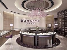 a fancy jewelry store with chandelier and glass display cases in the center area