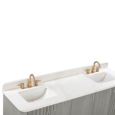 two white sinks sitting next to each other on top of a marble countertop with gold faucets