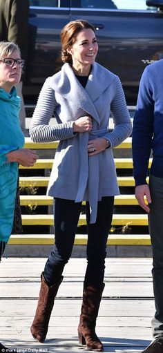 the duke and princess of cambridge are seen walking with their mother, who is wearing boots