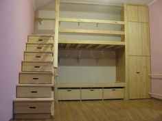 there is a bunk bed in the room with drawers on the bottom and stairs to the second floor