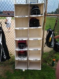 the baseball equipment is on display in the fenced area