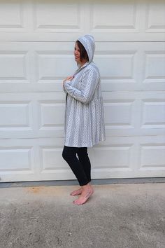 Our new hooded open cardigan is the definition of comfortable! This cardigan is a heather grey color with a white embroidered design throughout. It features long sleeves, a hood, and a babydoll style. You'll love how easy this cardigan is to wear and style. Wear it over your favorite winter outfit to add some warmth and a hint of your personal style! ABOUT THIS ITEM: Made in Mexico. Fabric is 82% Polyester / 14% Rayon / 4% Spandex. Hand wash cold. Hang or line dry. Fit is true to size. The model Hooded Cardigan For Spring Loungewear, Spring Hooded Loungewear Cardigan, Gray Hooded Cardigan For Spring, Spring Long Sleeve Cardigan With Drawstring Hood, Babydoll Style, Hooded Cardigan, Open Cardigan, Embroidered Design, Grey Color