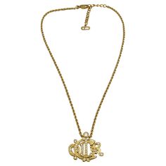 CHRISTIAN DIOR vintage gold tone chain necklace featuring a C DIOR logo pendant embellished with clear crystals. Adjustable lobster clasp closure. Embossed CHR. DIOR © GERMANY. Indicative measurements : chain length from approx. 39.5 cm (15.55 inches) to approx. 43.5 cm (17.13 inches) / logo pendant (including bail) approx 2.5 cm x 2.5 cm (0.98 inch x 0.98 inch). Material : Gold tone metal hardware / Crystal. NOTES - This is a preloved vintage item, therefore it might have imperfections. - Color Crystal Notes, Jewel Logo, Dior Logo, Dior Vintage, Christian Lacroix, Clear Crystals, Metal Hardware, Vintage Logo, Gold Tone Metal