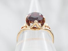 This stunning ring is crafted from luxurious yellow gold and set with a stunning garnet. Perfect for special occasions, this ring is sure to make a lasting impression.Metal: 10K Yellow GoldGem: Pyrope Garnet 3.83 CaratsGem Measurements: 8.2 x 10.0 mm, OvalRing Size: 7.50Marks: "10K PC" Stamped on the inside band Pyrope Garnet, Pocket Watch Chain, Watch Chain, Cocktail Ring, Pearl Pendant, Charm Earrings, Cocktail Rings, Beaded Chain, Shop Necklaces