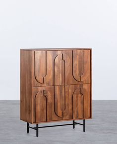 a wooden cabinet with four doors on the front and one door open to reveal an interesting design