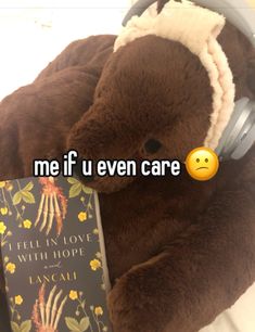 a teddy bear with headphones and a book on it's lap that says me if u even care