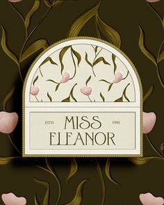 the logo for miss eleanor is surrounded by pink flowers and green leaves on a brown background