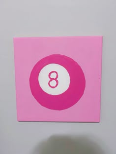 a pink square with the number eight painted on it