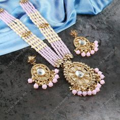 This is a stunning handmade necklace perfect for high end Jewelry Collector, a keeper in Traditional Vintage Indian/Pakistani Bridal jewelry and a Luxury Gift for your Daughter, Sister or Wife on Wedding or Anniversary. Perfect for any type of occasions, weddings And celebrations and a beautiful & memorable gift for weddings and special occasions. -Item Code:-  -Pink Beaded Rajwada Necklace Set with Earrings. -Designer multi layered beaded necklace with Kundan pendant. -Gold Plated Set with Kundan Stones which shine like Polki Diamonds. -Metal: Gold plated brass -Earrings are 68mm long & 28mm wide approx -Push Back Earrings -Necklace length with pendant 12" approx excluding adjustable dori/cord -Quantity: One Necklace Set Please see more different designs here:- https://www.etsy.com/in-en/ Luxury Pink Temple Jewelry Necklaces, Polki Diamond Necklace, Bridesmaid Pearl Necklace, Multi Layer Necklace Beads, Pink Beaded Necklace, Jodha Akbar, Pakistani Bridal Jewelry, Zircon Necklace, Bridesmaid Pearls