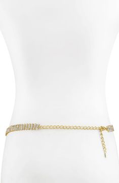 Linear crystal drops cascade like rain down a shimmering goldtone belt that brightens the center of any ensemble. 25" length; 8" extender Goldtone plate/cubic zirconia Imported Gold Chain Belt With Rhinestones For Party, Party Gold Chain Link Waist Chain, Elegant Gold Waist Chain For Festivals, Elegant Gold Metal Waist Chain, Gold Rhinestone Chain Belt For Party, Gold Crystal Body Chain With Adjustable Chain, Belly Jewelry Chain Waist Gold, Belly Chain, Crystal Drop