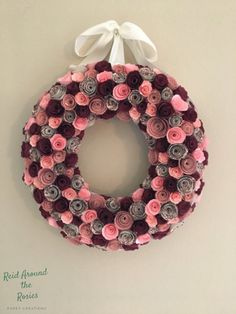 a wreath made out of rolled paper flowers