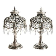 a pair of silver table lamps with crystal beads