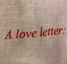 a white t - shirt with the words a love letter on it's chest