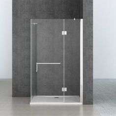 a bathroom with a glass shower door and grey walls, in front of a white tiled wall