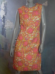 This 1960s sheath dress has a stunning abstract floral pattern in pink, purple, and pale chartreuse on a cream background. The sleeveless summer dress is crafted from an accordion textured viscose fabric. Note that the stitched hemline has been let out at some point, and so you can leave it as is or hem it to your preferred length (see pix). Bust = 38 inches (96cm) Waist = 36 inches (91.44cm) Hips = 42 inches (106.68cm) Dress Length = 41 inches (104.14cm) Back Zipper = 20 inches (50.8cm) Size: 1 Pink Sleeveless Dress With Retro Print, Fitted Sleeveless Dress With Vintage Pattern, Formal Cocktail Party, Mad Men Dresses, Vintage Midi Dresses, European Dress, Sleeveless Dress Summer, European Vintage, Viscose Fabric