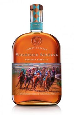 a bottle of whiskey with horses running on the track in front of it and a white background