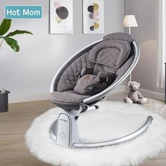 a baby's rocking chair in the middle of a living room