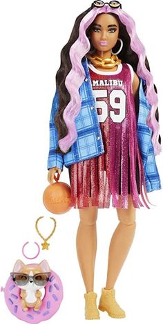 a barbie doll is standing next to a toy doughnut and an eyeglass case