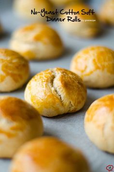 freshly baked bread rolls on a baking sheet