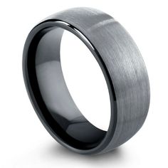 a men's wedding band that is black and grey with a brushed finish on the inside