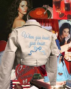 the back of a woman's white jacket with pictures on it and other items