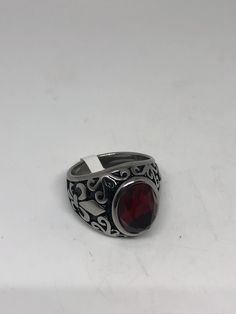 Vintage Red Ruby Glass Mens Ring Stainless Steel Deco design about half an inch Cool Vintage Rock and Roll star men's ring Nice heavy ring, Stainless Steel Unused stock from the 1980's I have an assortment of sizes from 7 - 9 - 10 - 11 - 12 or 13 ONLY. Please add your size to the order in a message and I will send the size you require. If I am out of stock in your size, I will list the ones I have available for replacement. If I am sold out in the sizes you would prefer, I will cancel and refund Vintage Red Signet Ring, Retro Red Ring Jewelry, Rock And, Mens Stainless Steel Rings, Vintage Gothic, Vintage Rock, Mens Ring, White Band, Men's Ring