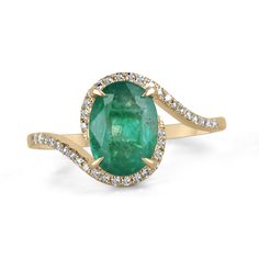 A beautiful, oval emerald and diamond ladies' ring. The center gemstone features a lovely 1.65-carat, natural oval-cut emerald with remarkable qualities. Carefully prong set, with micro-pave set diamonds accenting the bypass shank. Crafted in gleaming 14K yellow gold. Setting Style: Prong/Pave Setting Material: 14K Yellow Gold Setting Weight: 2.3 Grams Main Stone: Emerald Shape: Oval Cut Weight: 1.65-Carats Clarity: Semi-Transparent Color: Lush Dark Green Luster: Good Treatments: Natural, Oiling Origin: Zambia Secondary Stone: Diamond Weight: 0.15-Carats (Total) Cut: Round Clarity: VS Color: H Luster: Excellent Treatments: Natural Estimated Retail Value: $6,490.00 USD A certificate of appraisal is provided upon purchase. Keep in mind we custom create all of the items listed here. If you ha Oval Green Diamond Gemstones, Oval Emerald Birthstone Ring In Fine Jewelry Style, Oval Brilliant Cut Gemstones For Fine Jewelry, Oval Brilliant Cut Emerald Gemstones, Exquisite Oval Gemstones With Halo Setting, Exquisite Oval Emerald Ring, Oval Emerald Gemstones With Halo Setting, Oval Cabochon Emerald Ring With Diamond, Fine Jewelry Oval Gemstones With Center Stone