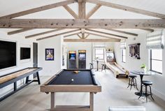 a pool table in the middle of a living room