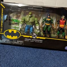 the batman action figures are in their original packaging