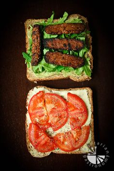 two slices of bread with tomatoes and meat on them, sitting next to each other