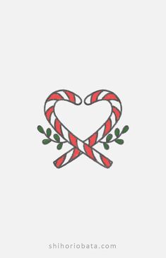 a red and white heart with two candy canes in the shape of a wreath