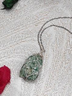 "Raw fuchsite mineral crystal women's necklace, the stone is wrapped with non tarnish copper wire silver plated. ✧ Hand selected natural raw gemstones ✧ Crystal size about 1,5*2mm, not including wire wrap. ✧ Each crystal chosen with care and handled with loving intention The chain length select from the drop down menu 41-46-50cm. Feel free to contact me for the other length or to order nylon or leather cord, yellow gold, pink gold plated copper wire for your necklace, size of stone or other wish Wire Wrapped Crystal Necklace, Wrapped Crystal Necklace, Wire Wrapped Crystal, Women's Necklace, Wrapped Crystal, Wire Wrapping Crystals, Length Necklace, Necklace Green, Necklace Crystal