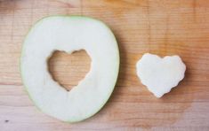 an apple with a heart cut in half