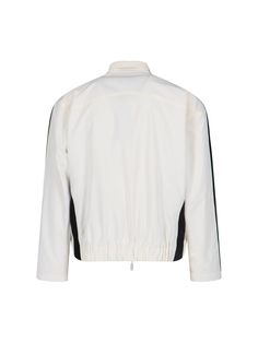 Rhude Ski Track jacket, in white fabric, turtleneck, double zip fastening, front logo print, two welt chest pockets, two side pockets, contrasting black sleeve details, elasticated waist detail on hem, straight hem. Composition: 100% Polyester Casual White Track Jacket With Stand Collar, White Stand Collar Track Jacket For Fall, White Track Jacket With Ribbed Cuffs For Outdoor, White Windbreaker With Ribbed Cuffs For Fall, White Casual Track Jacket With Contrast Panels, Casual White Track Jacket With Contrast Panels, Casual Windbreaker With Contrast Panels, Sporty Track Jacket With Zip Cuffs For Work, White Outdoor Outerwear With Side Pockets