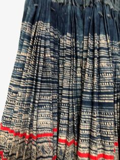 "An exquisite, authentic, tribal Hmong skirt from the Northern Vietnamese hill tribes. Made of dyed, indigo hemp with ribbon like embroidered pieces in repeated patterns and colors, hand stitched applique with cotton and silk threads. The Hmong claim to originate from the Yellow River region of China, in around 3000 BC; though some experts state it was later than this. It wasn't until the 1800s that they began to migrate; first spreading to Indochina, then to Northern Laos, Burma, Thailand and V Bohemian Cotton Skirt With Batik Print, Traditional Blue Cotton Skirt, Traditional Blue Skirt For Festivals, Traditional Blue Skirt With Traditional Patterns, Traditional Blue Skirt, Hmong Skirt, Hudson Bay Blanket, Paj Ntaub, Yellow River