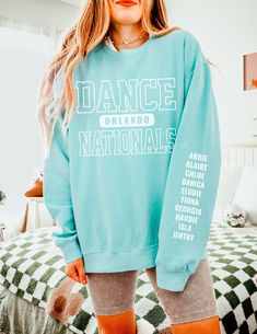 Custom City Dance Nationals Crewneck, Personalized Names Sleeve Dance Gear, Retro Competitive Dancer Gift, Unisex Comfort Colors Sweatshirt How To Order - Please make sure you have looked at all sizes and color charts. - Select from the various T-shirt sizes and colors from scroll-down menus. - Fill in the personalization box (if provided) as exemplified. - Click "Add to cart" button. You can turn back and add more items of different size and color. Order Process - Our processing time is 5-10 da Dance Nationals Shirts, Dance Merchandise Ideas, Stretch Letter Print Tops For Dance, Long Sleeve Graphic Print Tops For Dance, Graphic Print Long Sleeve Tops For Dance, White Crew Neck Top For Dance Class, Stretch Long Sleeve Tops For Dance Class, Long Sleeve Letter Print Top For Dance Class, Long Sleeve Graphic Print Top For Dance Class