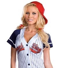 a woman in a baseball uniform is posing for the camera