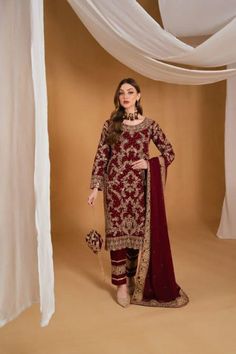 Elevate your wardrobe with this stunning maroon three-piece Pakistani designer dress, perfect for weddings, parties, and special occasions. Crafted from luxurious chiffon, the intricately embroidered top features exquisite embellishments that add a touch of glamour. Paired with soft butter silk trousers, this outfit ensures comfort and elegance in any season. The accompanying chiffon dupatta completes the look, making it ideal for guests or as a thoughtful gift for her. Whether you're attending Eid Dress, Formal Wedding Guests, Salwar Dress, Dress Salwar Kameez, Eid Dresses, Party Kleidung, Chiffon Dupatta, Silk Trousers, Pakistani Dress Design