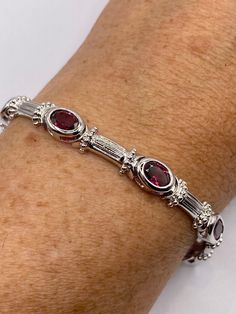 Vintage Bohemian Red Garnet Bracelet 925 Sterling Silver This genuine bright red Garnets  bracelet is very lively and bright.   The stones are deep colors and well matched.   The sterling silver is tarnished from age. Can be re polished.  This is longer bracelet 7.5 in My jeweler can shorten it for a $20 fee  All jewelry is shipped free in the US in a nice gift box.   Check out our over a THOUSAND great reviews Engraving is $4 per letter and is not always perfect depending on the piece. It can t Classic Red Gemstone Bracelets, Classic Red Gemstone Bracelet, Red Oval Tennis Bracelet Fine Jewelry, Red Oval Gemstone Bracelet, Red Oval Fine Jewelry Tennis Bracelet, Luxury Red Oval Bracelet, Red Gemstone Tennis Bracelet In Fine Jewelry Style, Red Gemstone Tennis Bracelet Fine Jewelry, Classic Red Bangle Jewelry