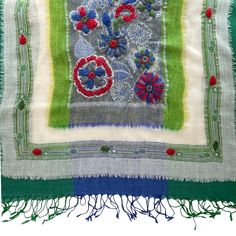 Lightweight, soft, comfy and cozy, these handmade scarf shawls are crafted out of fine pashmina wool, skillfully embroidered by hand and detailed with tassel fringe. Measures: 27 inches wide 72 inches long 100% Wool Hand wash lukewarm water Cool iron. Hang dry or Dry Clean. Green Embroidered Bohemian Shawl, Traditional Handmade Green Shawl, Bohemian Multicolor Embroidered Pashmina Fabric, Bohemian Pashmina With Multicolor Embroidery, Bohemian Pashmina Embroidered Fabric, Traditional Green Handloom Scarves, Traditional Green Handloom Scarf, Traditional Handmade Pashmina Shawl, Folk Style Embroidered Shawl Scarf