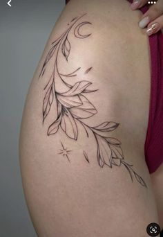 a woman's thigh with an artistic tattoo design on the thighs and lower back