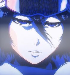 an anime character wearing a helmet with her eyes closed