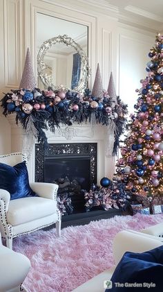 a living room decorated for christmas with pink, blue and silver decorations on the fireplace