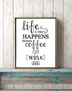 a sign that says life is what happens between coffee and wine on the wall above a bench