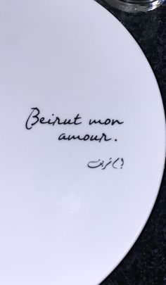 a white plate with writing on it that says, beintt won anoun