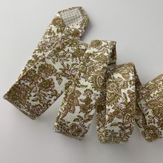 This handmade floral tie is an excellent accessory for weddings, parties, proms - an excellent gift for anyone who enjoys dressing-up dapper! Style: Slim/narrow Fabric: 100% cotton Approx. Measurements: (W) 2.4 in. x (L) 58 in. Dry clean only Matching Men's Bow Tie Style: Pre-tied (w/ adjustable straps) Fabric: 100% cotton Size: Mens | One size Bow measures approx. 4.75 in. x 2.4 in. Dry clean only Matching Pocket Square Fabric: 100% cotton Approx. 12 in. x 12 in. Dry clean only Thank you! Adjustable Ties Neckwear For Wedding, Adjustable White Tie For Wedding, White Standard Tie For Wedding, Adjustable Wedding Neckwear Ties, Floral Print Standard Tie For Wedding, Floral Print Ties For The Groom, Floral Print Standard Tie For Groom, Green Floral Ties Men, Mens Floral Tie